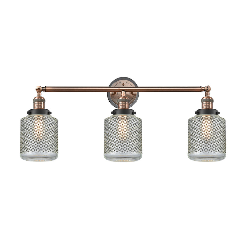 Stanton Bath Vanity Light shown in the Antique Copper finish with a Clear Wire Mesh shade