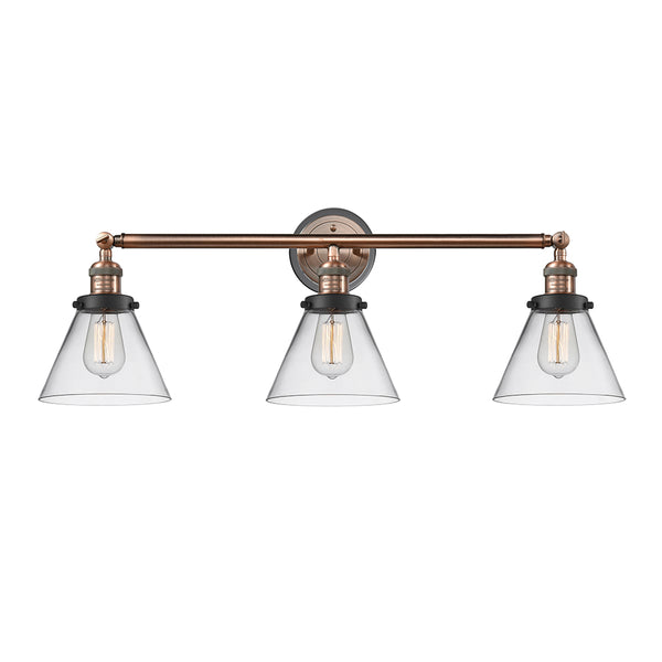 Cone Bath Vanity Light shown in the Antique Copper finish with a Clear shade