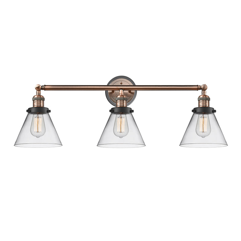 Cone Bath Vanity Light shown in the Antique Copper finish with a Clear shade