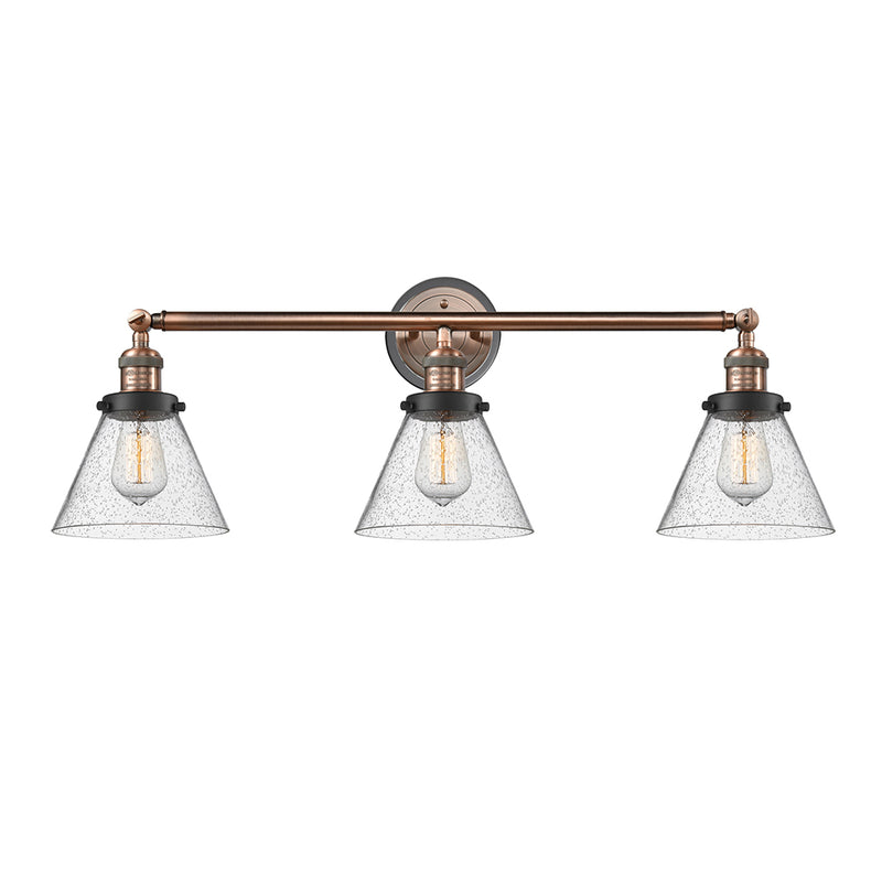 Cone Bath Vanity Light shown in the Antique Copper finish with a Seedy shade