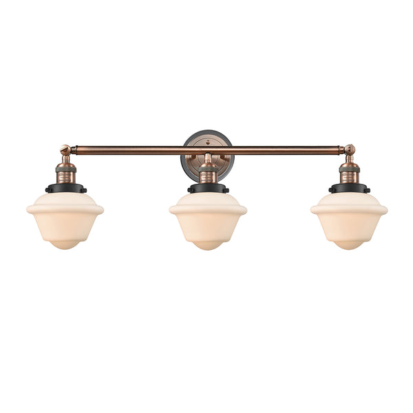 Oxford Bath Vanity Light shown in the Antique Copper finish with a Matte White shade