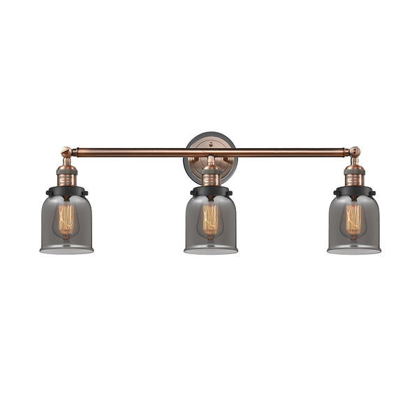 Bell Bath Vanity Light shown in the Antique Copper finish with a Plated Smoke shade