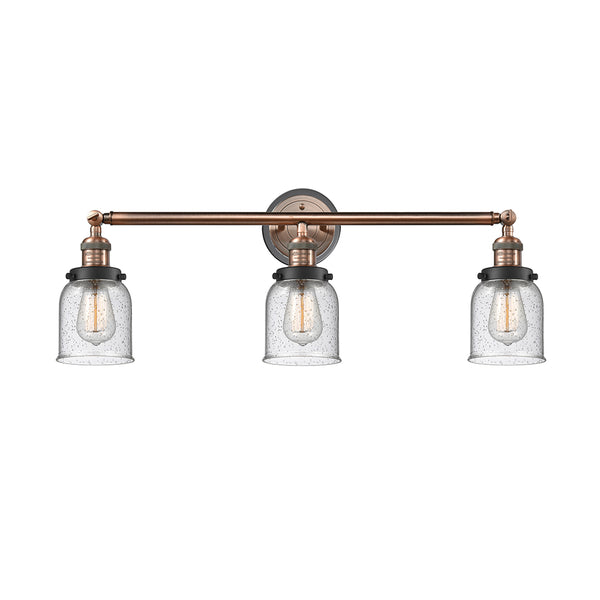 Bell Bath Vanity Light shown in the Antique Copper finish with a Seedy shade