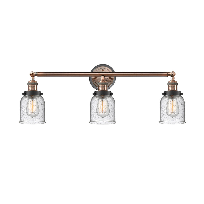Bell Bath Vanity Light shown in the Antique Copper finish with a Seedy shade