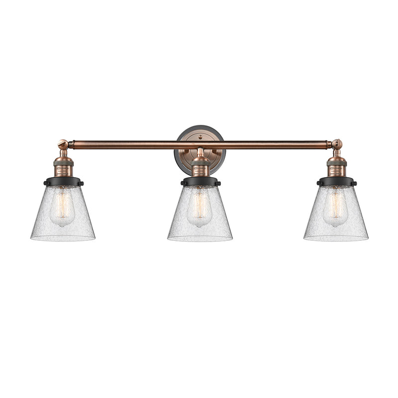 Cone Bath Vanity Light shown in the Antique Copper finish with a Seedy shade