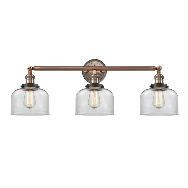 Bell Bath Vanity Light shown in the Antique Copper finish with a Clear shade