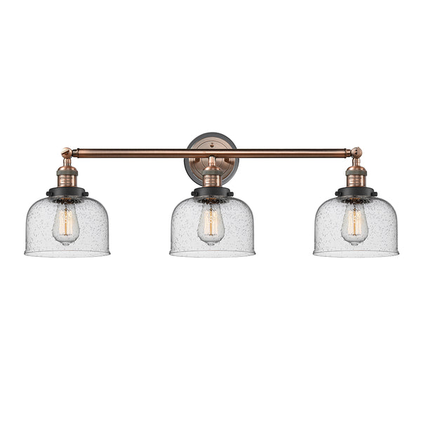 Bell Bath Vanity Light shown in the Antique Copper finish with a Seedy shade