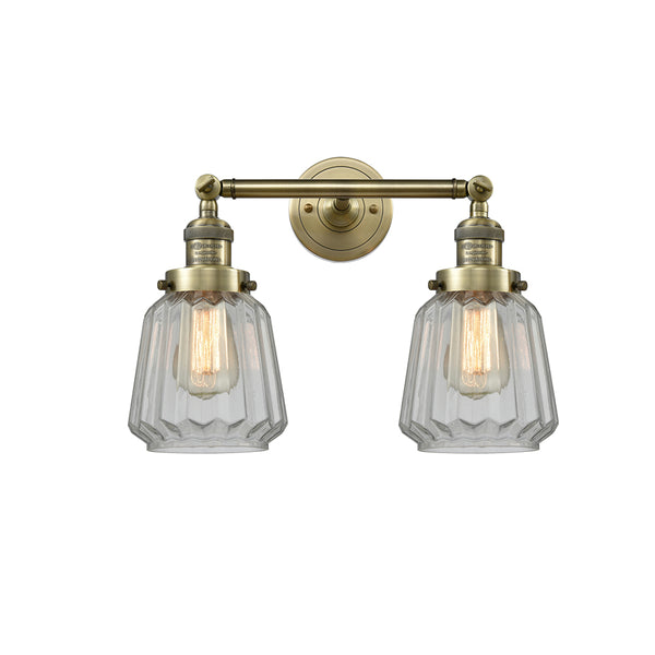 Chatham Bath Vanity Light shown in the Antique Brass finish with a Clear shade