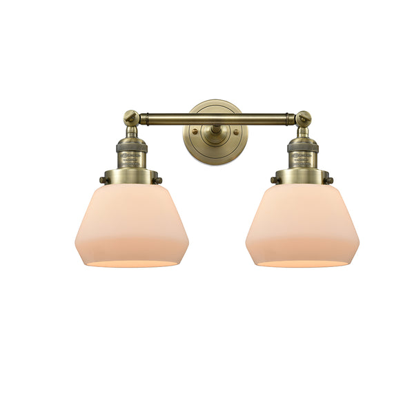 Fulton Bath Vanity Light shown in the Antique Brass finish with a Matte White shade