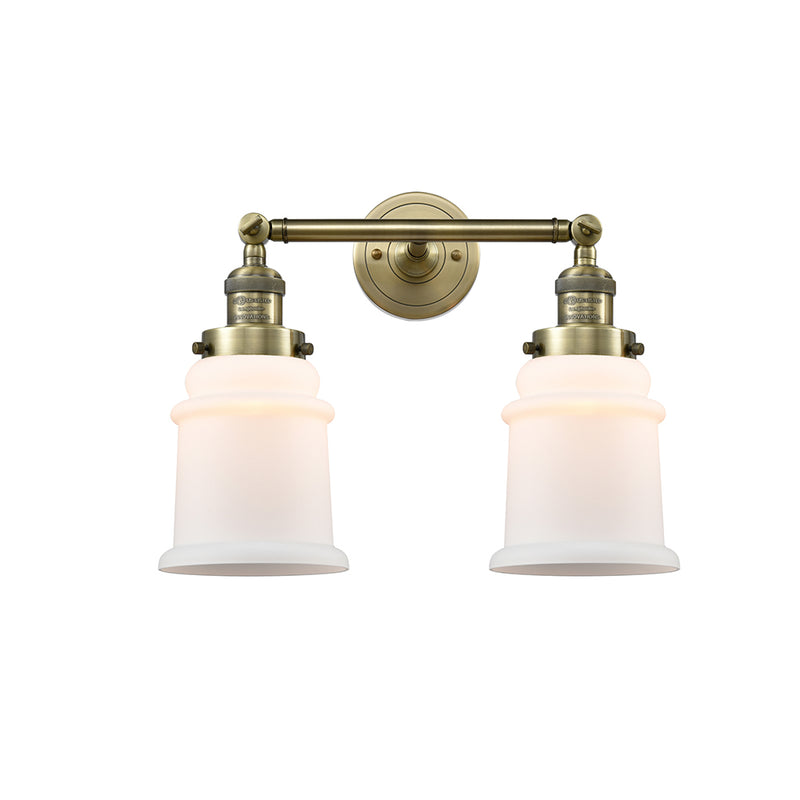 Canton Bath Vanity Light shown in the Antique Brass finish with a Matte White shade
