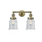 Canton Bath Vanity Light shown in the Antique Brass finish with a Clear shade