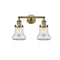 Bellmont Bath Vanity Light shown in the Antique Brass finish with a Clear shade