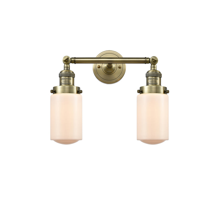 Dover Bath Vanity Light shown in the Antique Brass finish with a Matte White shade