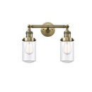 Dover Bath Vanity Light shown in the Antique Brass finish with a Clear shade