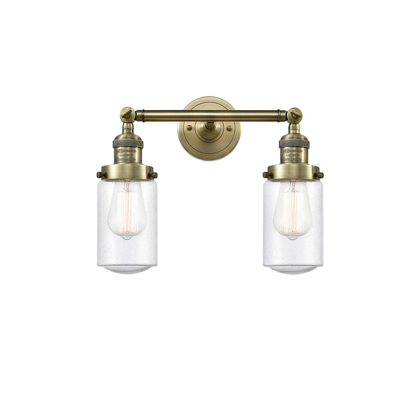 Dover Bath Vanity Light shown in the Antique Brass finish with a Seedy shade