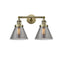 Cone Bath Vanity Light shown in the Antique Brass finish with a Plated Smoke shade