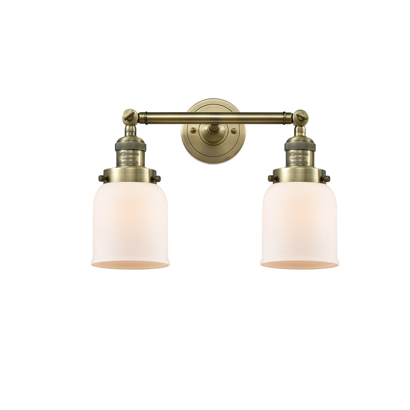 Bell Bath Vanity Light shown in the Antique Brass finish with a Matte White shade