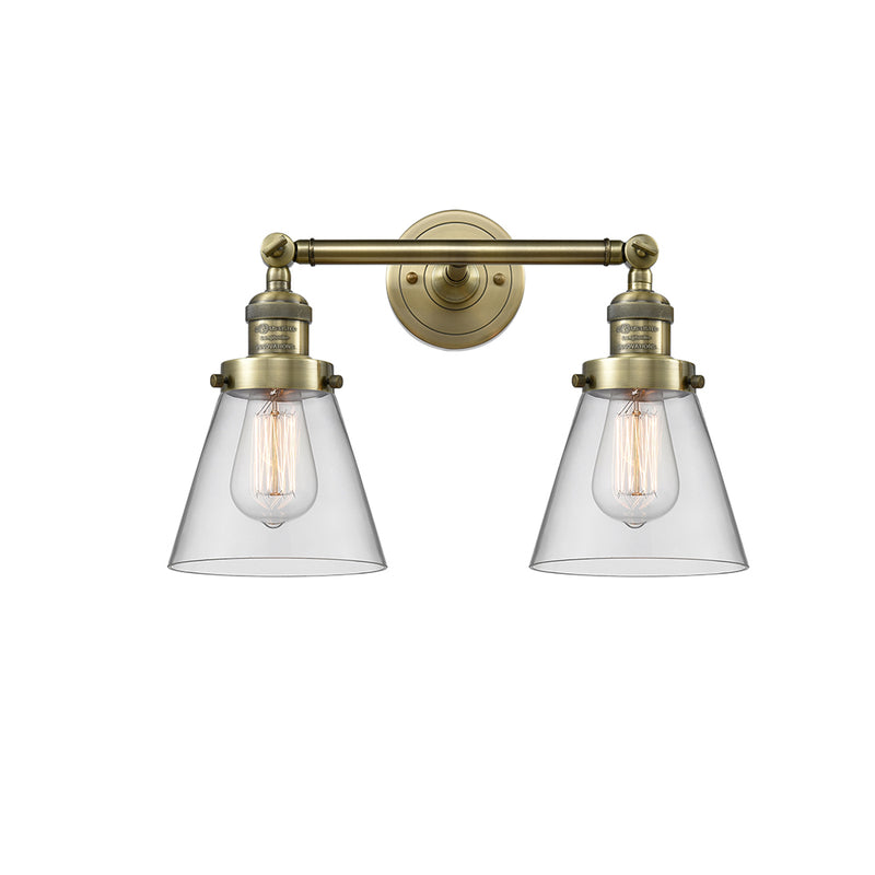 Cone Bath Vanity Light shown in the Antique Brass finish with a Clear shade