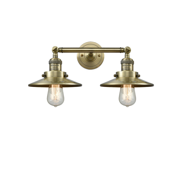 Railroad Bath Vanity Light shown in the Antique Brass finish with a Antique Brass shade
