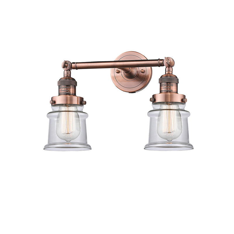 Canton Bath Vanity Light shown in the Antique Copper finish with a Clear shade