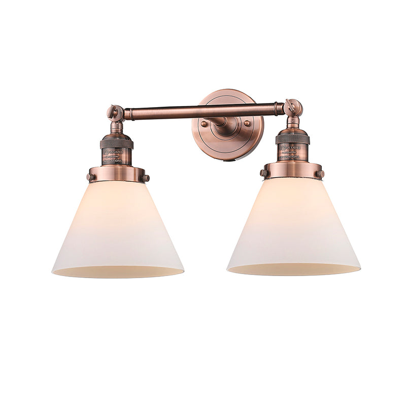 Cone Bath Vanity Light shown in the Antique Copper finish with a Matte White shade
