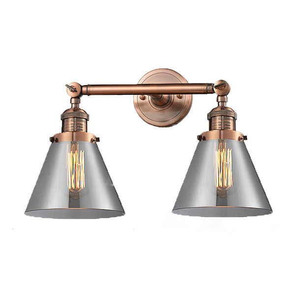 Cone Bath Vanity Light shown in the Antique Copper finish with a Plated Smoke shade