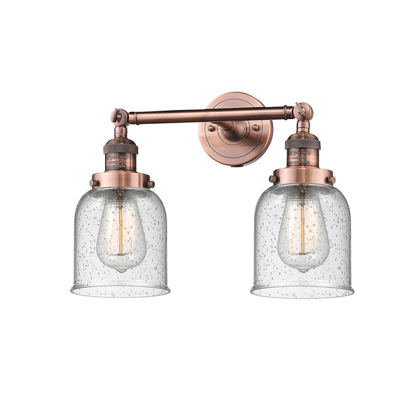 Bell Bath Vanity Light shown in the Antique Copper finish with a Seedy shade