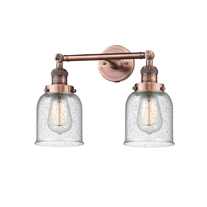 Bell Bath Vanity Light shown in the Antique Copper finish with a Seedy shade