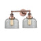 Bell Bath Vanity Light shown in the Antique Copper finish with a Clear shade