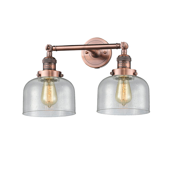 Bell Bath Vanity Light shown in the Antique Copper finish with a Seedy shade