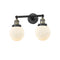 Beacon Bath Vanity Light shown in the Black Antique Brass finish with a Matte White shade