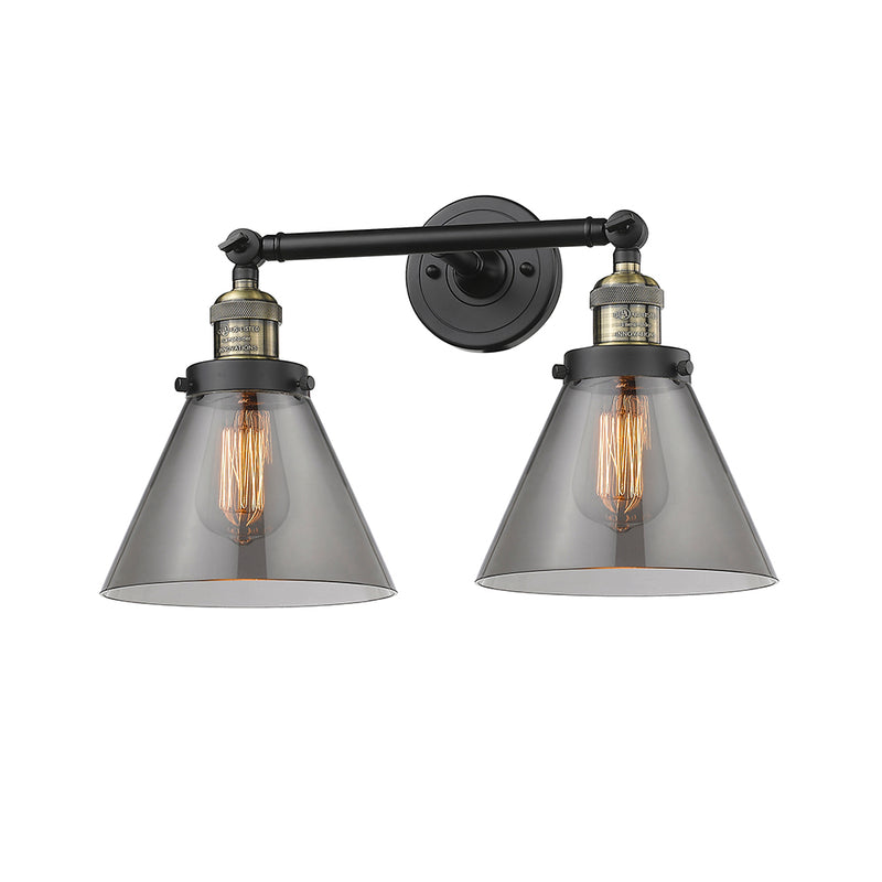 Cone Bath Vanity Light shown in the Black Antique Brass finish with a Plated Smoke shade