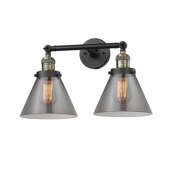Cone Bath Vanity Light shown in the Black Antique Brass finish with a Plated Smoke shade