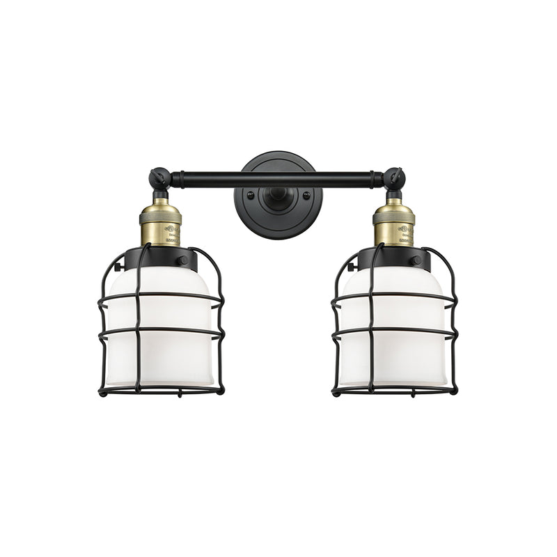 Bell Cage Bath Vanity Light shown in the Black Antique Brass finish with a Matte White shade
