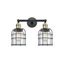 Bell Cage Bath Vanity Light shown in the Black Antique Brass finish with a Clear shade