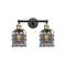 Bell Cage Bath Vanity Light shown in the Black Antique Brass finish with a Plated Smoke shade