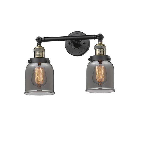 Bell Bath Vanity Light shown in the Black Antique Brass finish with a Plated Smoke shade