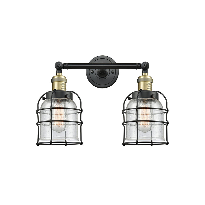 Bell Cage Bath Vanity Light shown in the Black Antique Brass finish with a Seedy shade