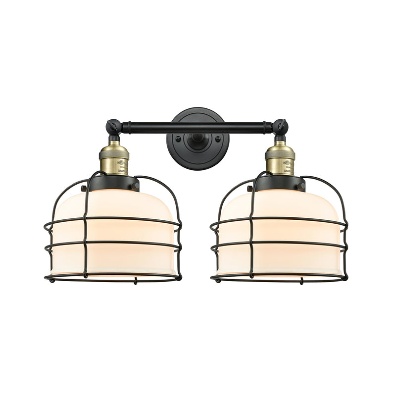 Bell Cage Bath Vanity Light shown in the Black Antique Brass finish with a Matte White shade