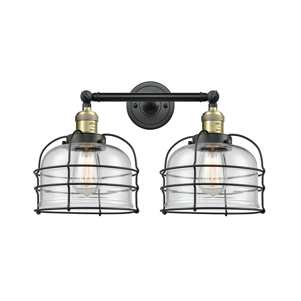 Bell Cage Bath Vanity Light shown in the Black Antique Brass finish with a Clear shade