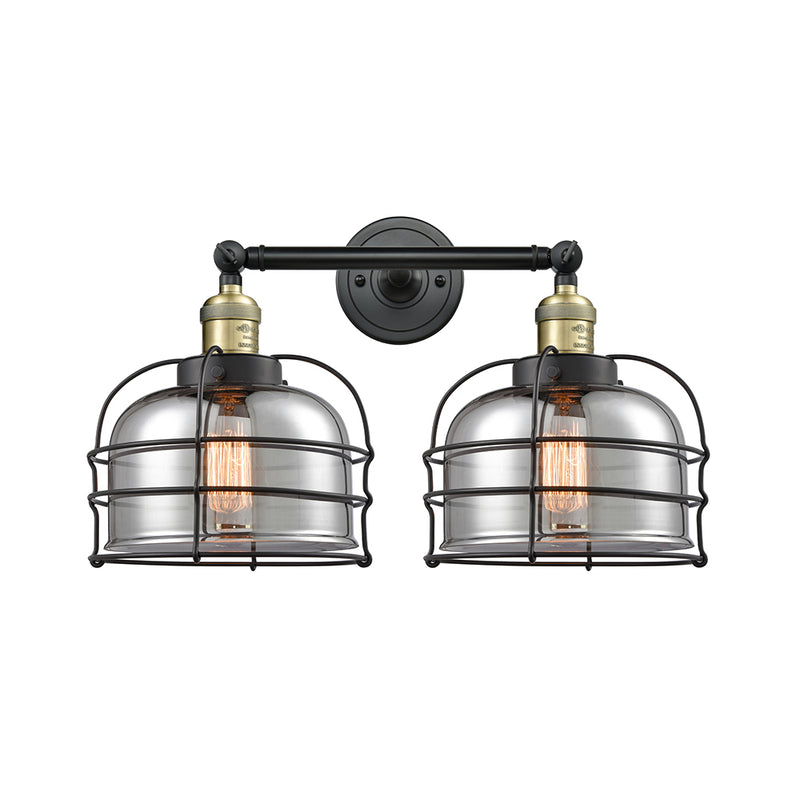 Bell Cage Bath Vanity Light shown in the Black Antique Brass finish with a Plated Smoke shade