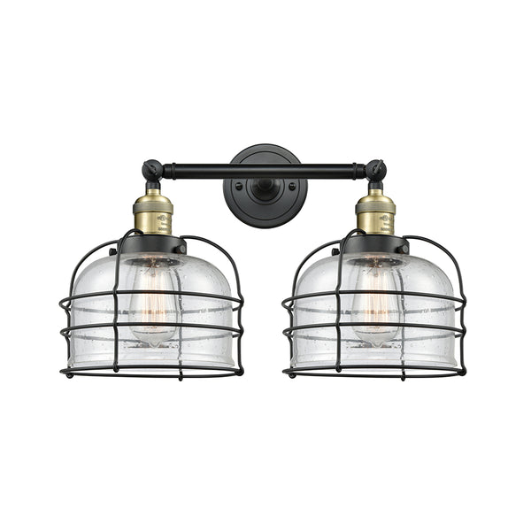 Bell Cage Bath Vanity Light shown in the Black Antique Brass finish with a Seedy shade