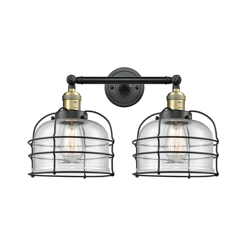 Bell Cage Bath Vanity Light shown in the Black Antique Brass finish with a Seedy shade