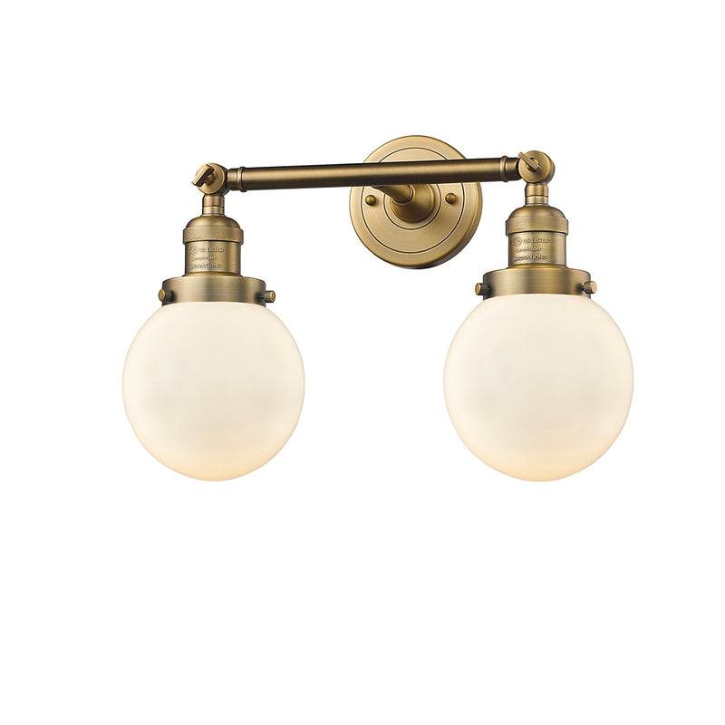 Beacon Bath Vanity Light shown in the Brushed Brass finish with a Matte White shade