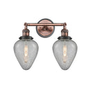 Geneseo Bath Vanity Light shown in the Antique Copper finish with a Clear Crackled shade