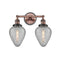 Geneseo Bath Vanity Light shown in the Antique Copper finish with a Clear Crackled shade