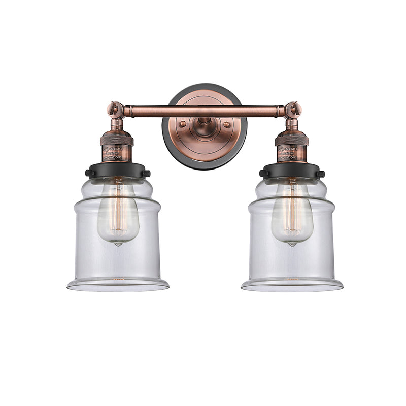 Canton Bath Vanity Light shown in the Antique Copper finish with a Clear shade