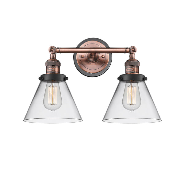 Cone Bath Vanity Light shown in the Antique Copper finish with a Clear shade