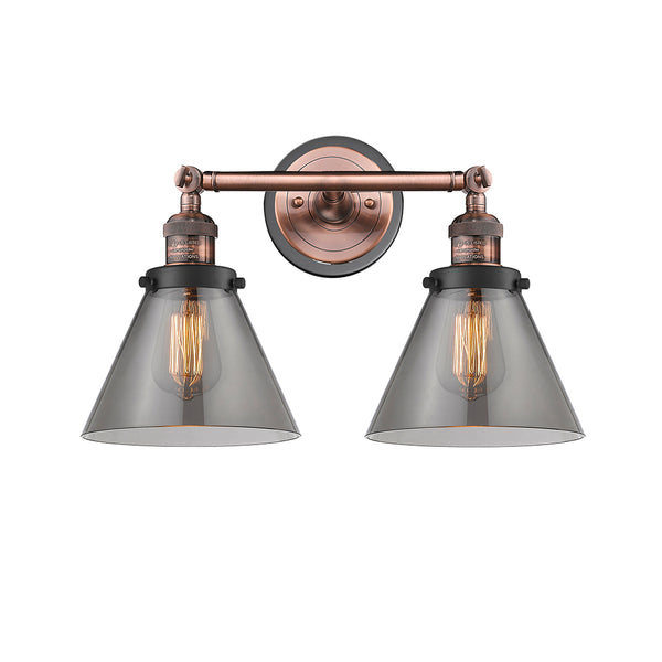 Cone Bath Vanity Light shown in the Antique Copper finish with a Plated Smoke shade