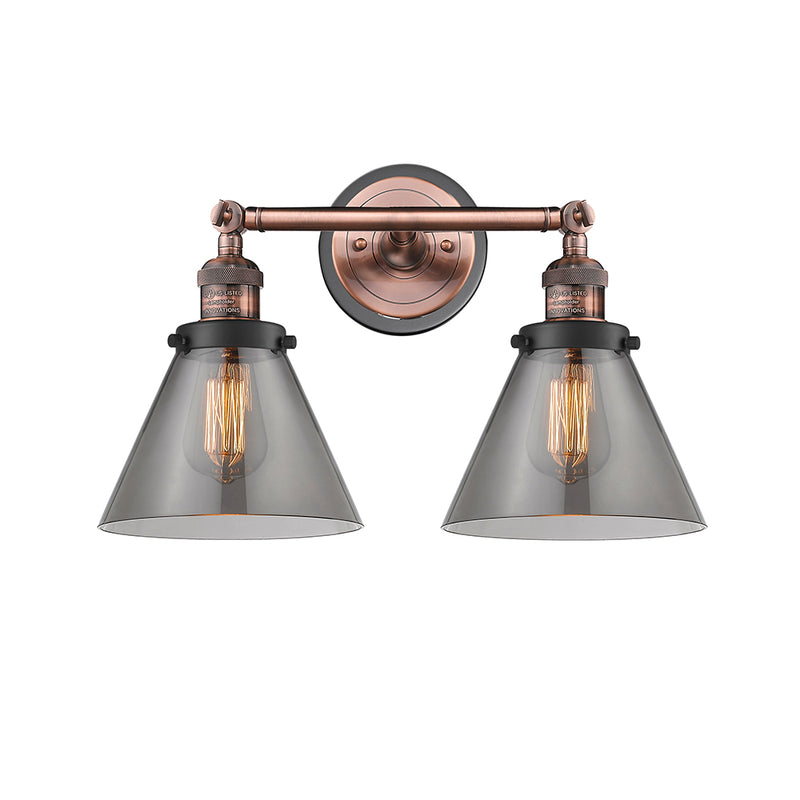Cone Bath Vanity Light shown in the Antique Copper finish with a Plated Smoke shade